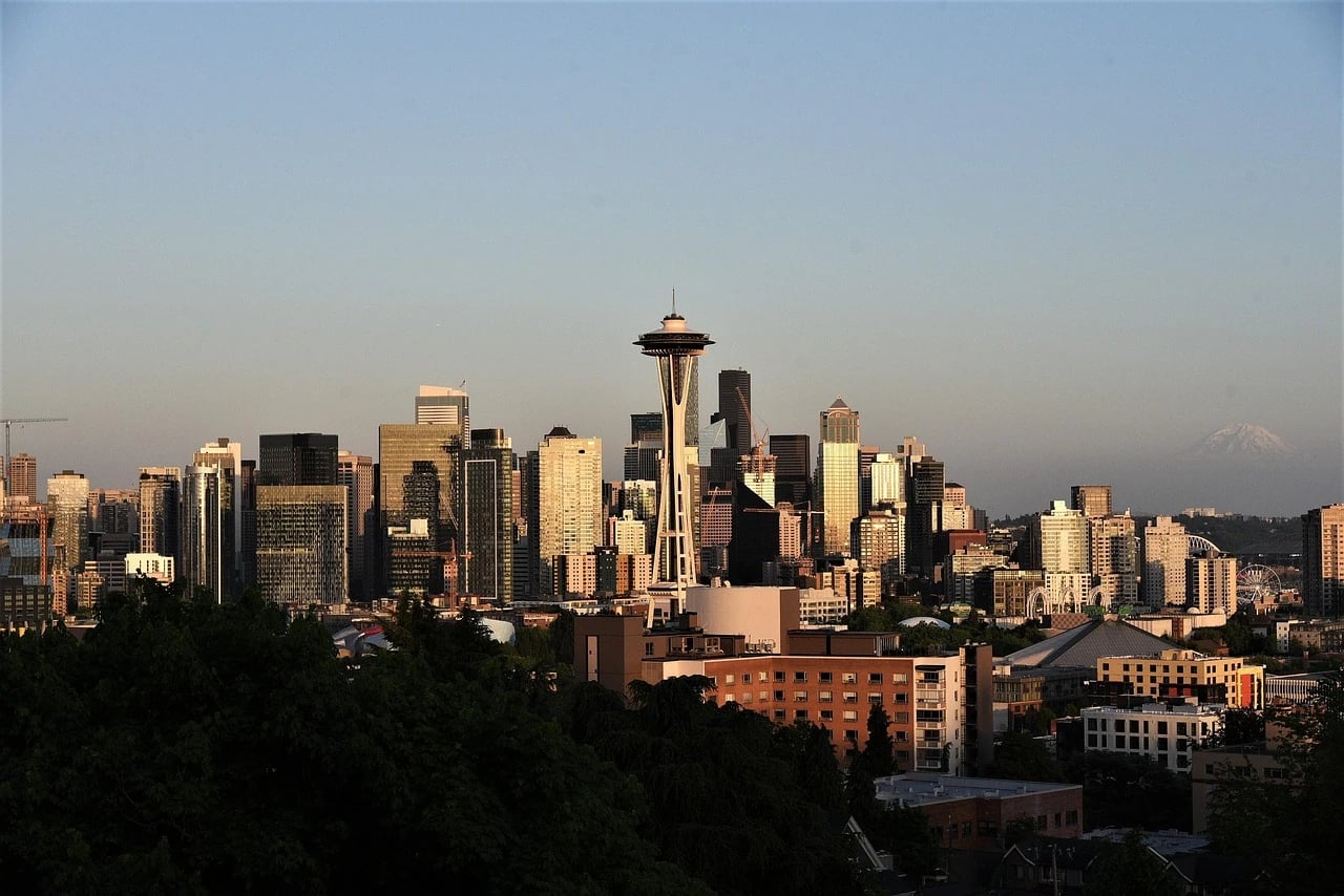 Seattle skyline at golden hour with the Space Needle, downtown towers and Mount Rainier in the distance