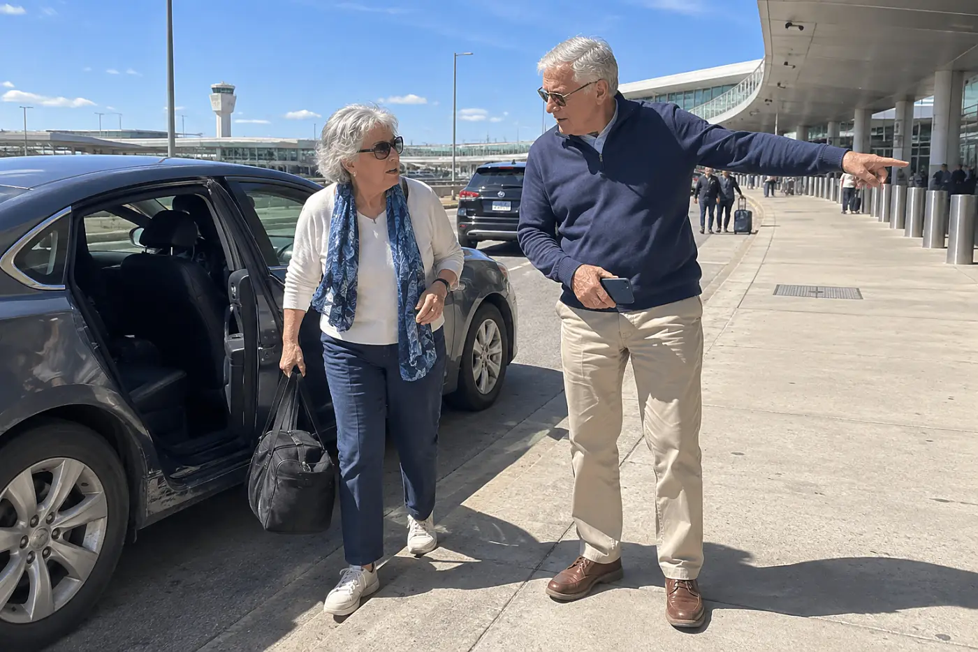 Older woman checking airport pickup signs while standing beside her car.
