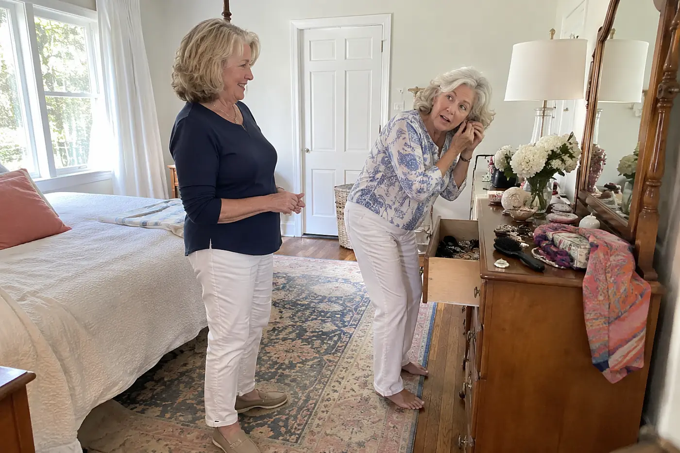 Older woman fastening a large earring at her bedroom dresser.
