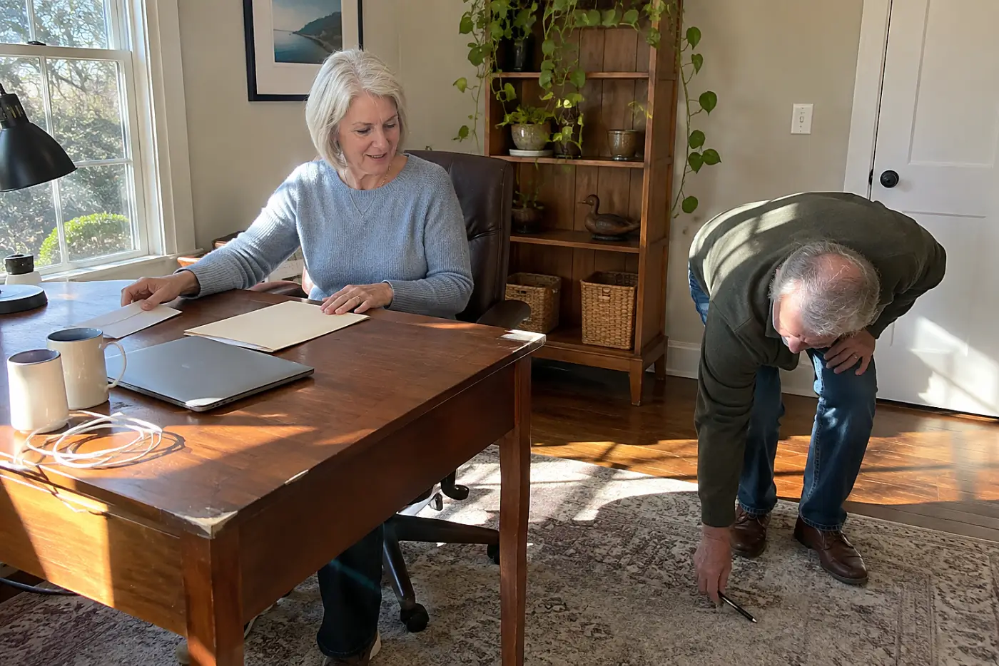 Woman comparing a retirement plan fee notice with her account statement at her desk.