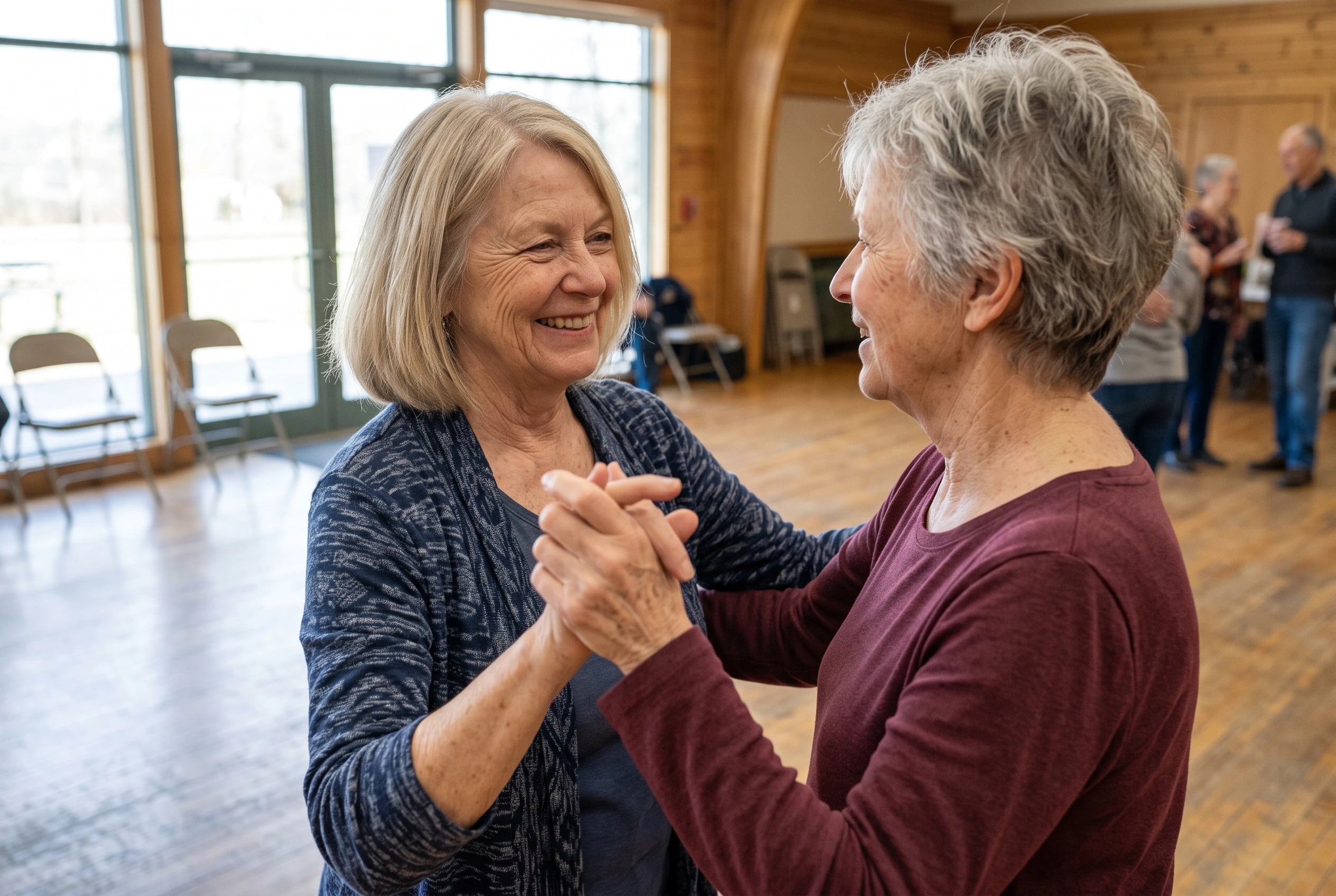 Woman in her sixties turning with a partner on a community center dance floor.